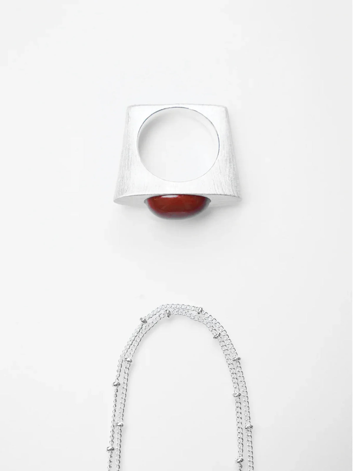 ON IISLAND OVAL RED AGATE PENDANT RING | TROVE & TONE