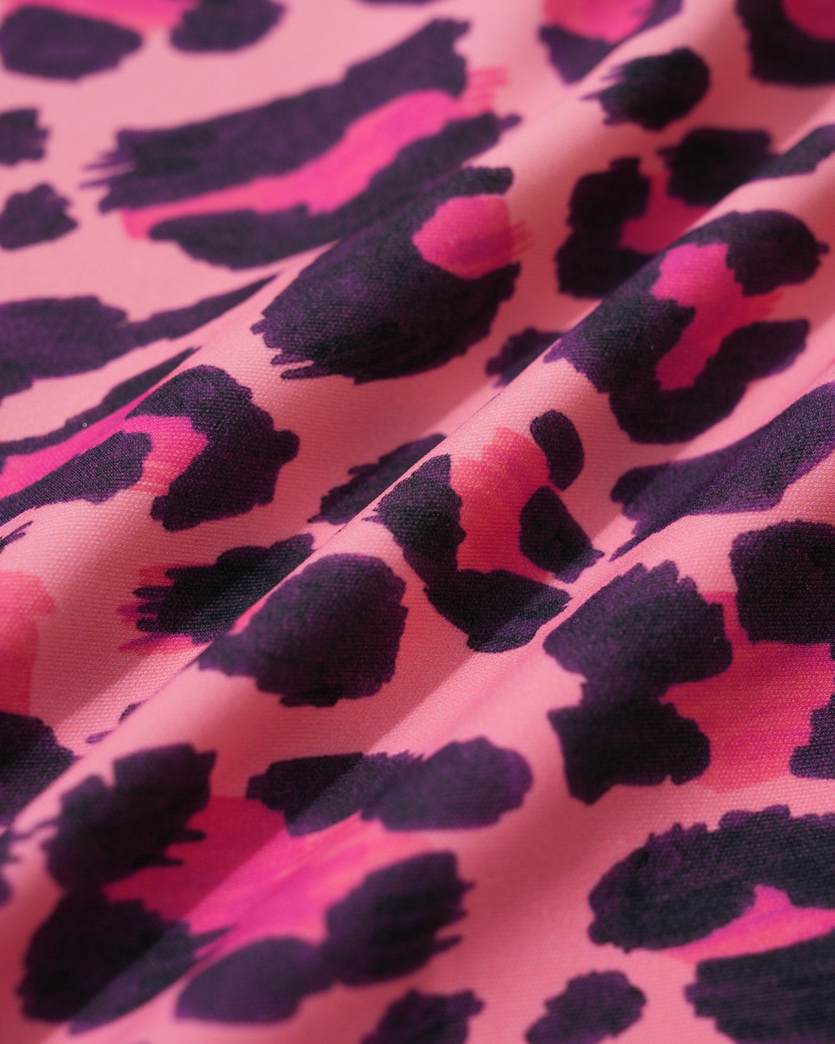 Wavvves LEOPARD PRINT SLEEVELESS TWIST-KNOT OPEN-BACK ONE-PIECE SWIMSUIT | TROVE & TONE
