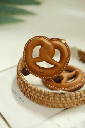 ChengTian HANDMADE LEATHER PRETZEL CHARM | TROVE & TONE