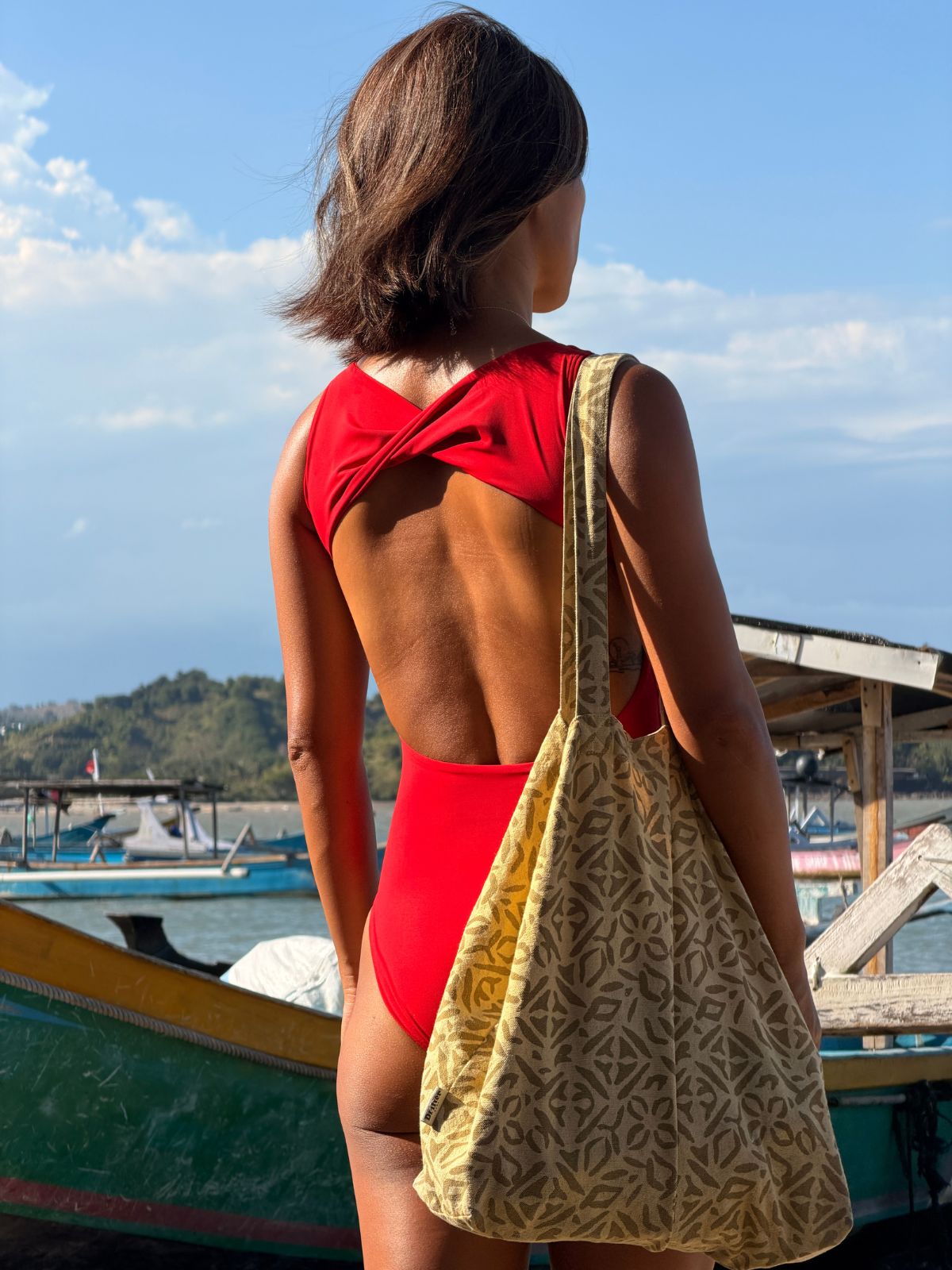 Wavvves RED SLEEVELESS TWIST-KNOT OPEN-BACK ONE-PIECE SWIMSUIT  |  TROVE & TONE