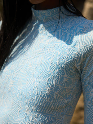 Wavvves FLORAL EMBOSSED LONG SLEEVE SURF SWIMSUIT BLUE  |  TROVE & TONE